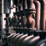 grayscale photo of metal pipe
